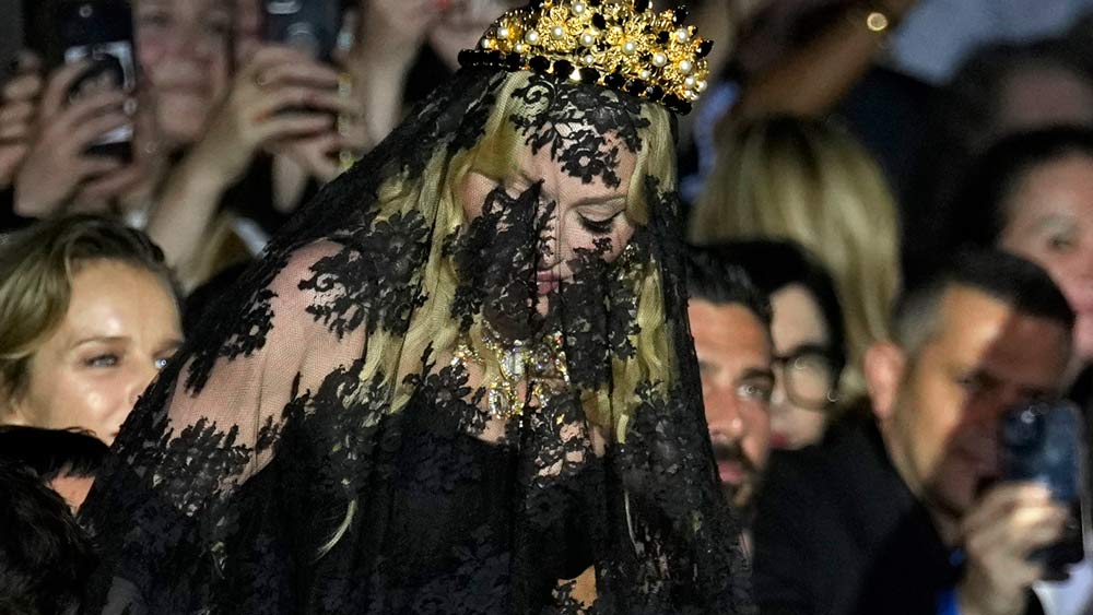 Milan Fashion Week: Madonna Makes Veiled Entrance to Dolce&Gabbana for Show Celebrating her 1990s Heyday